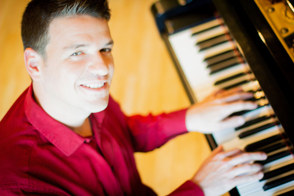 Brady Goss Headshot Piano Keys Big Red Barn Studios